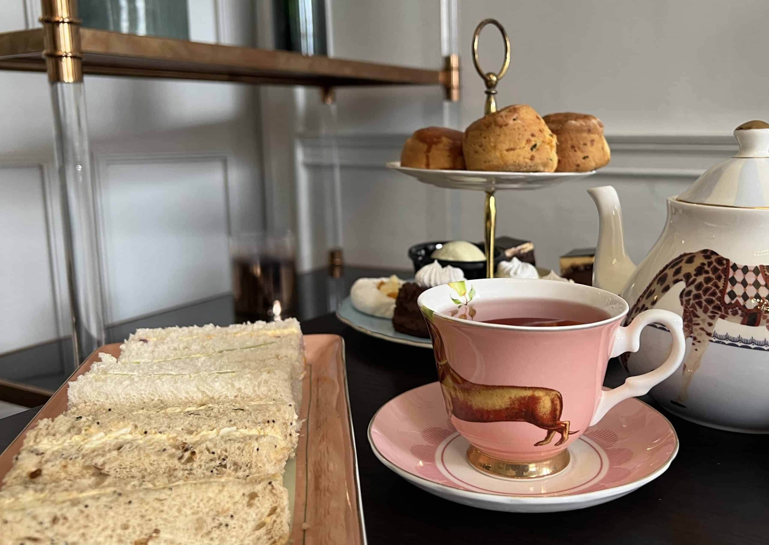 Selection of sandwiches and cake stand